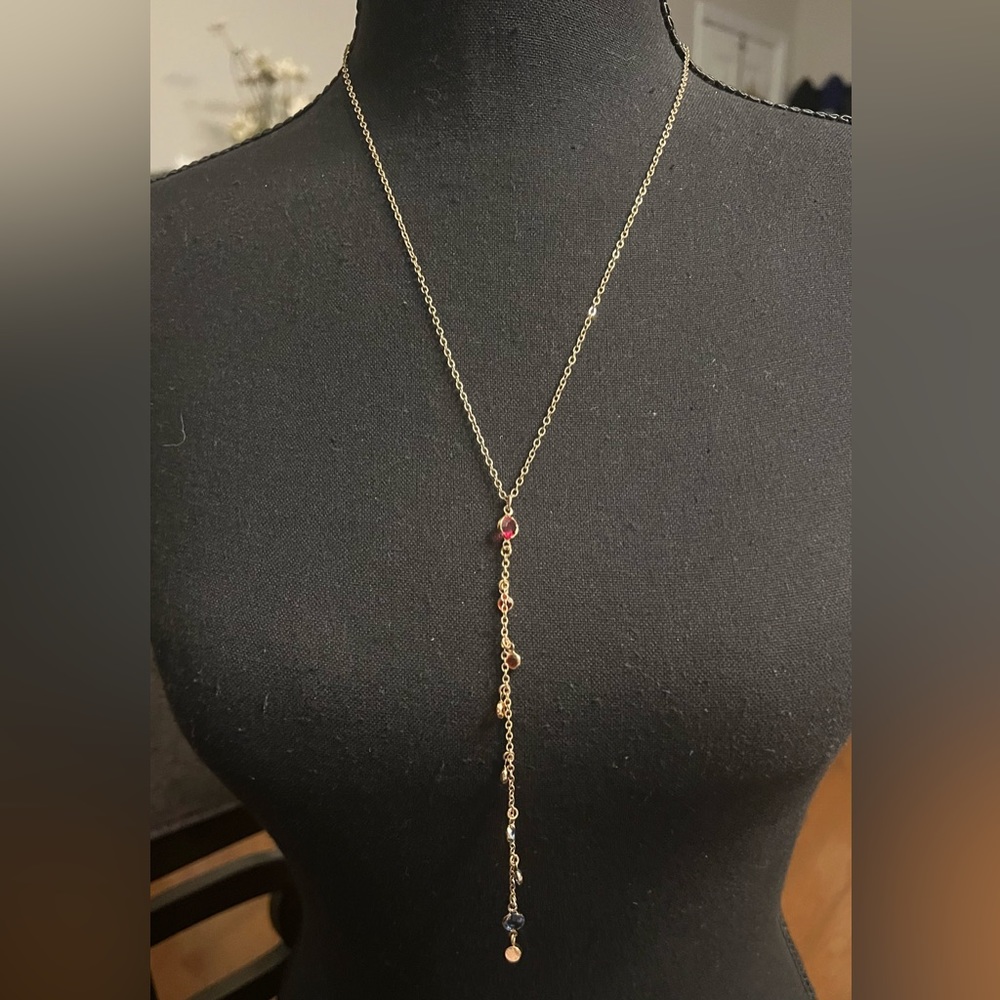 Multicolored stones adorn this gold plated chain